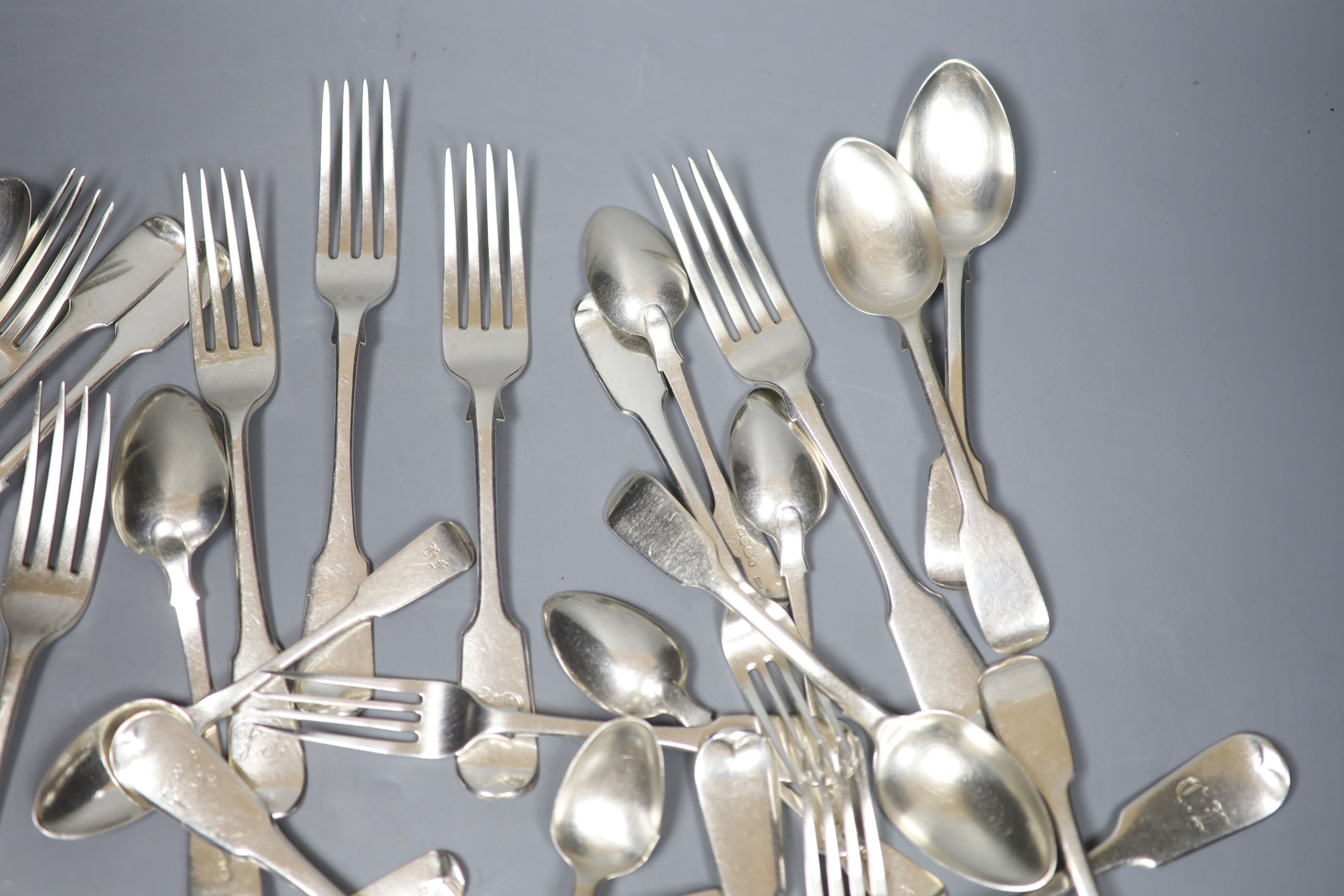 A matched part service of Old English pattern silver flatware, Georgian and later, some initialled, approx 55oz